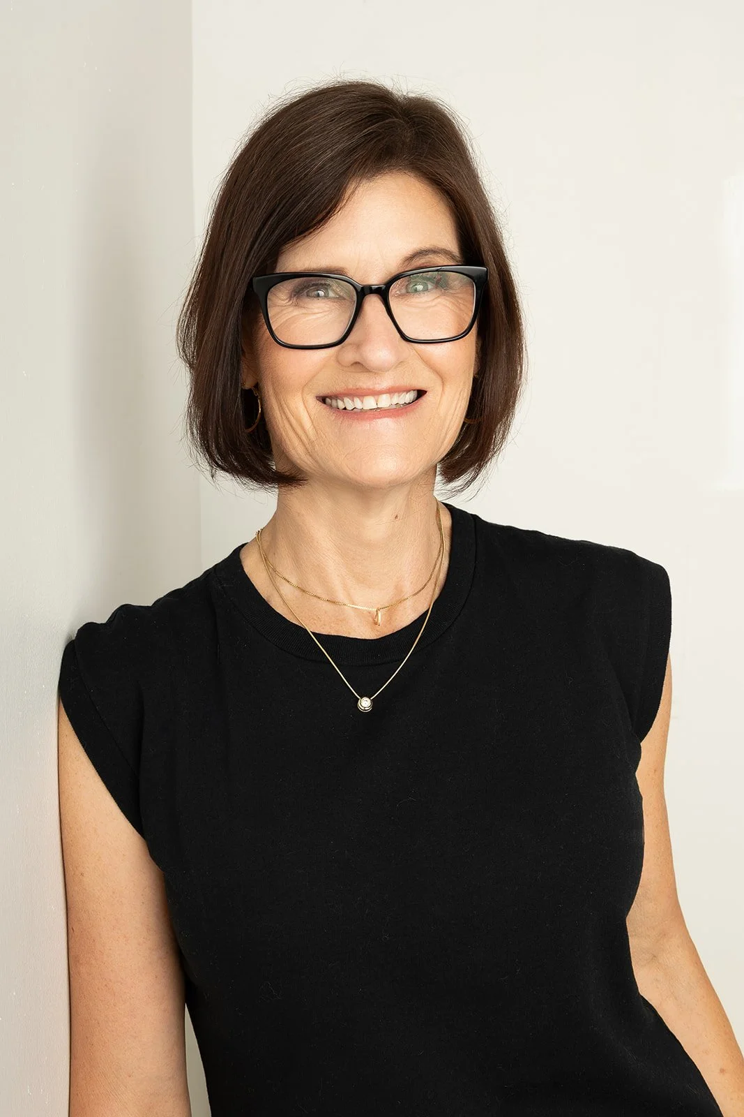 Portrait of Patti Moynihan, smiling warmly.